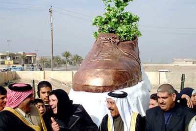 bronzed shoe statue